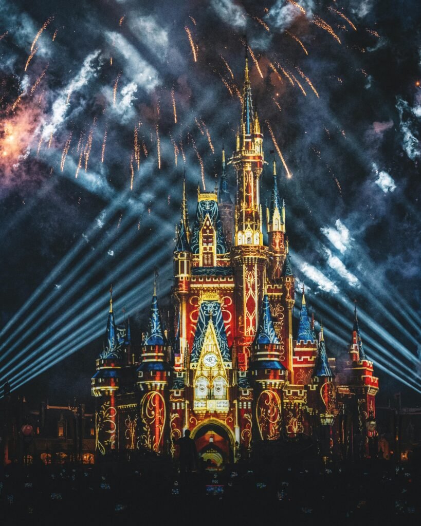 Stunning night view of an illuminated castle with fireworks display.